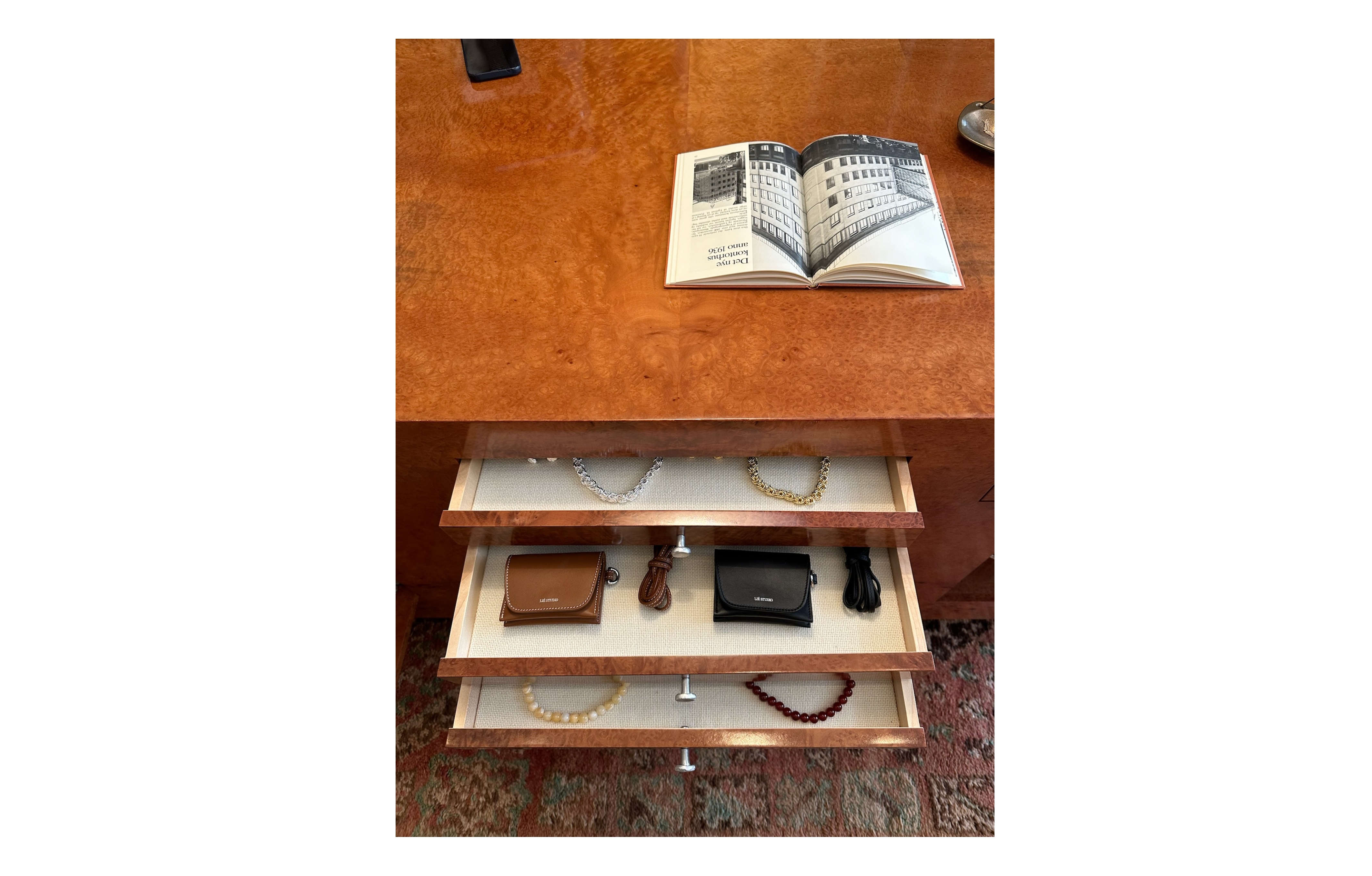 The bespoke centerpiece in the store houses a mix between jewelry and leather pieces. If you visit, feel free to open up the drawers to see what they are hiding!